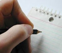 hand writing on notepad